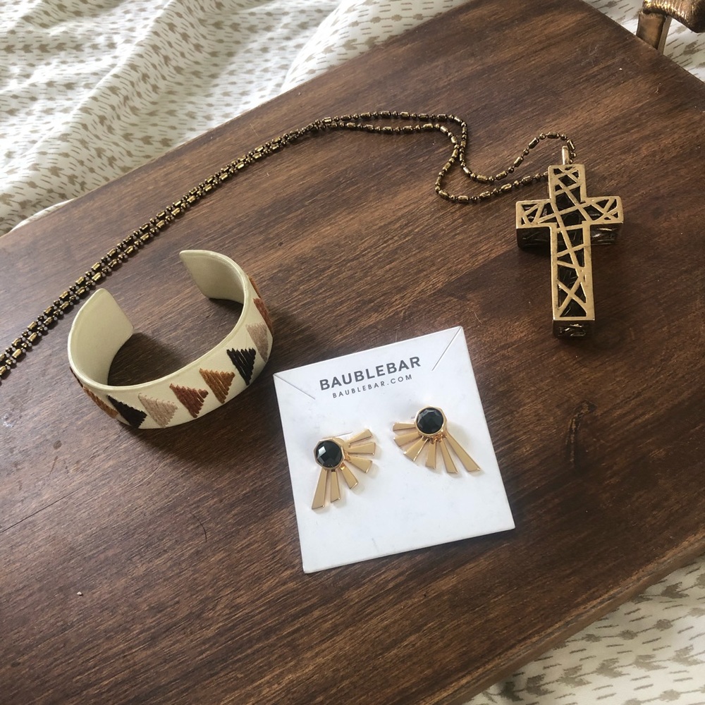 Gold long cross necklace.